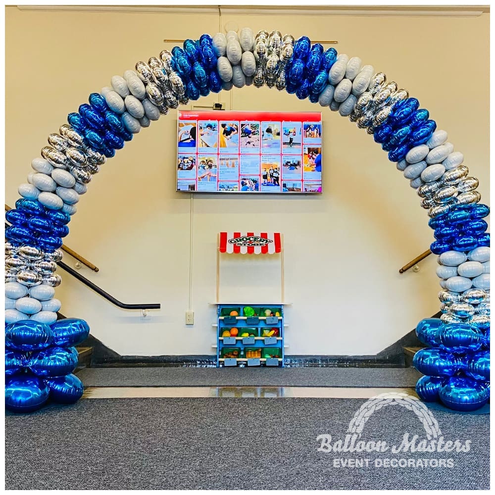 Silver blue and white balloon arch.